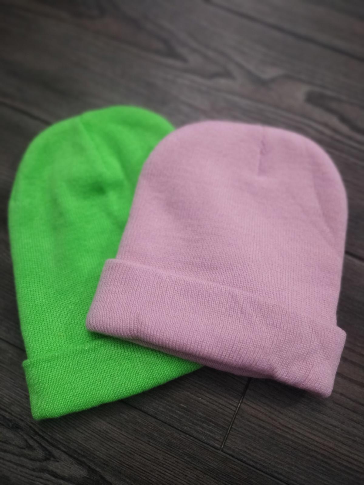 Pink and neon green beanie hats