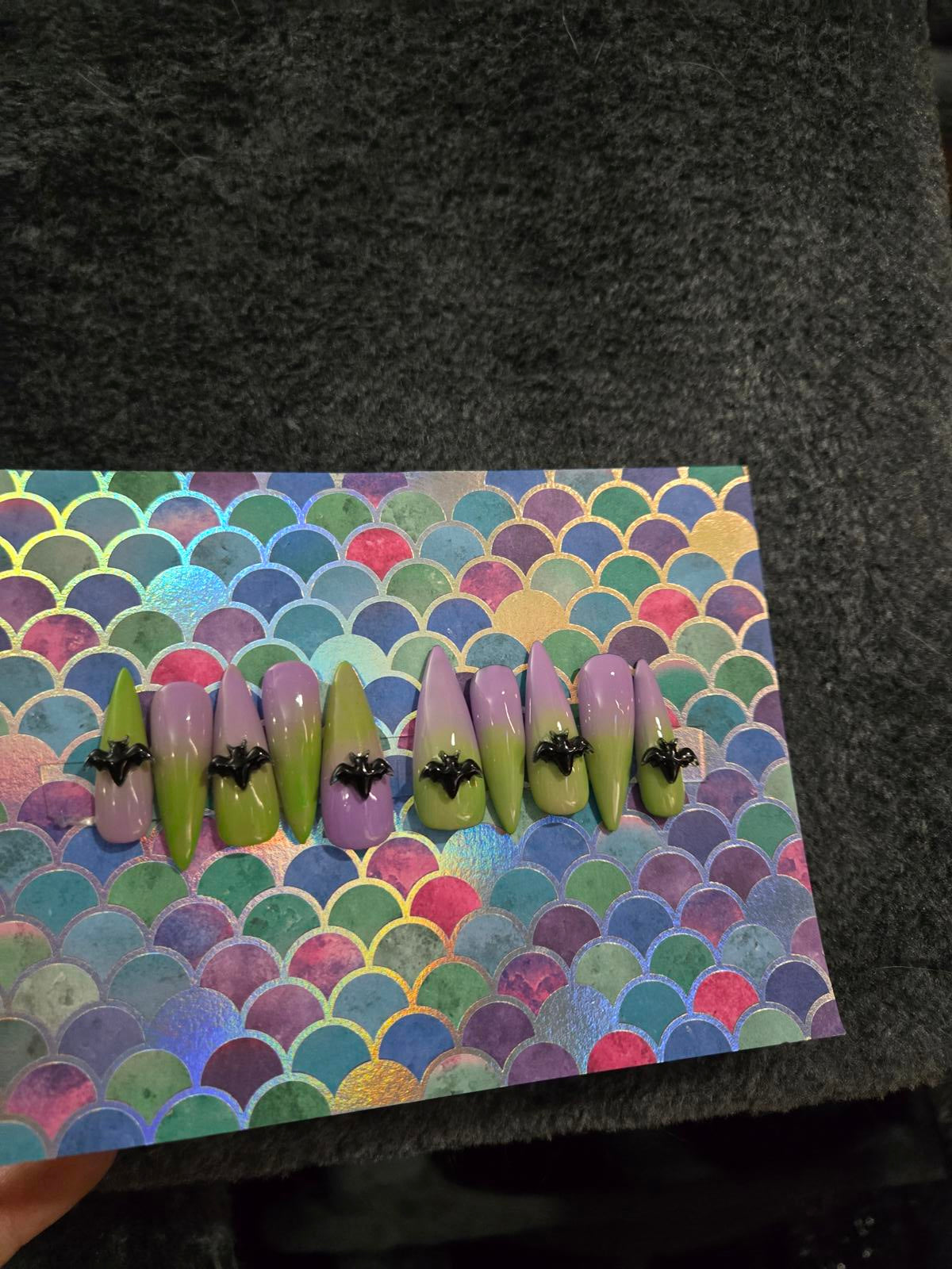 Long stiletto press on nails green to lavender ombre with bat charms