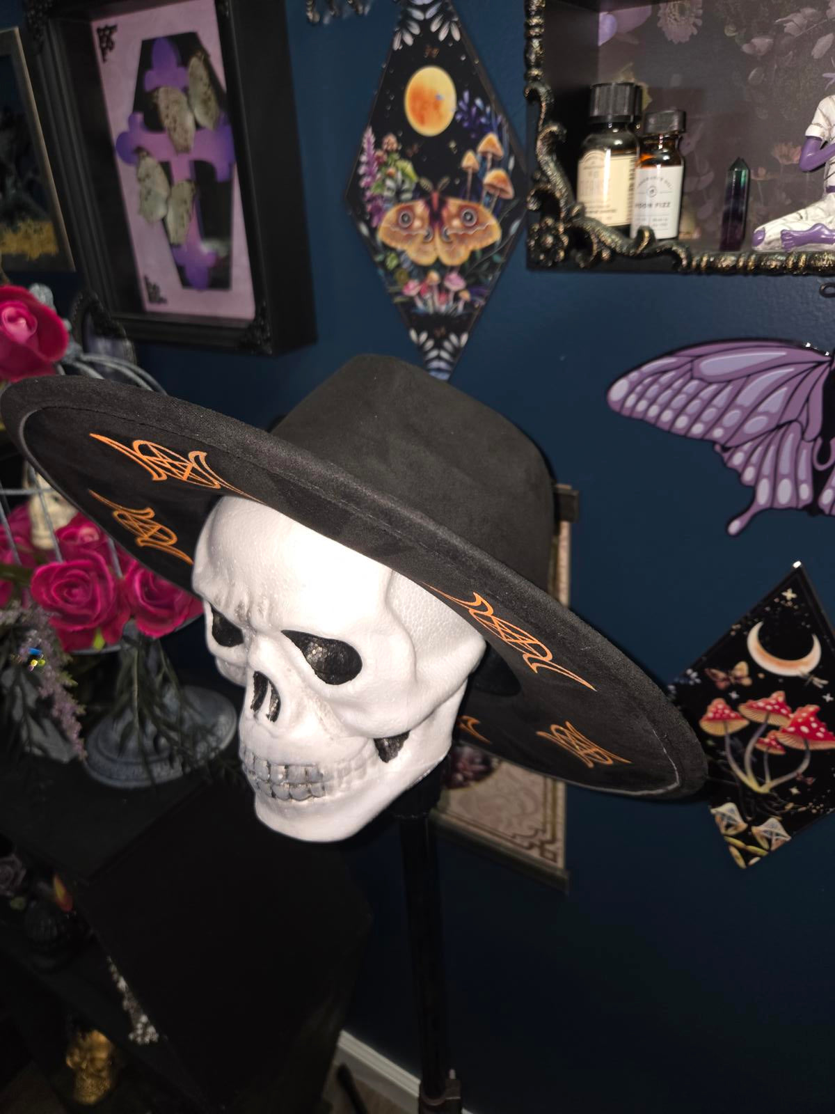 Black vegan suede wide brim fedora hat with sparkly orange moons and pentagrams
