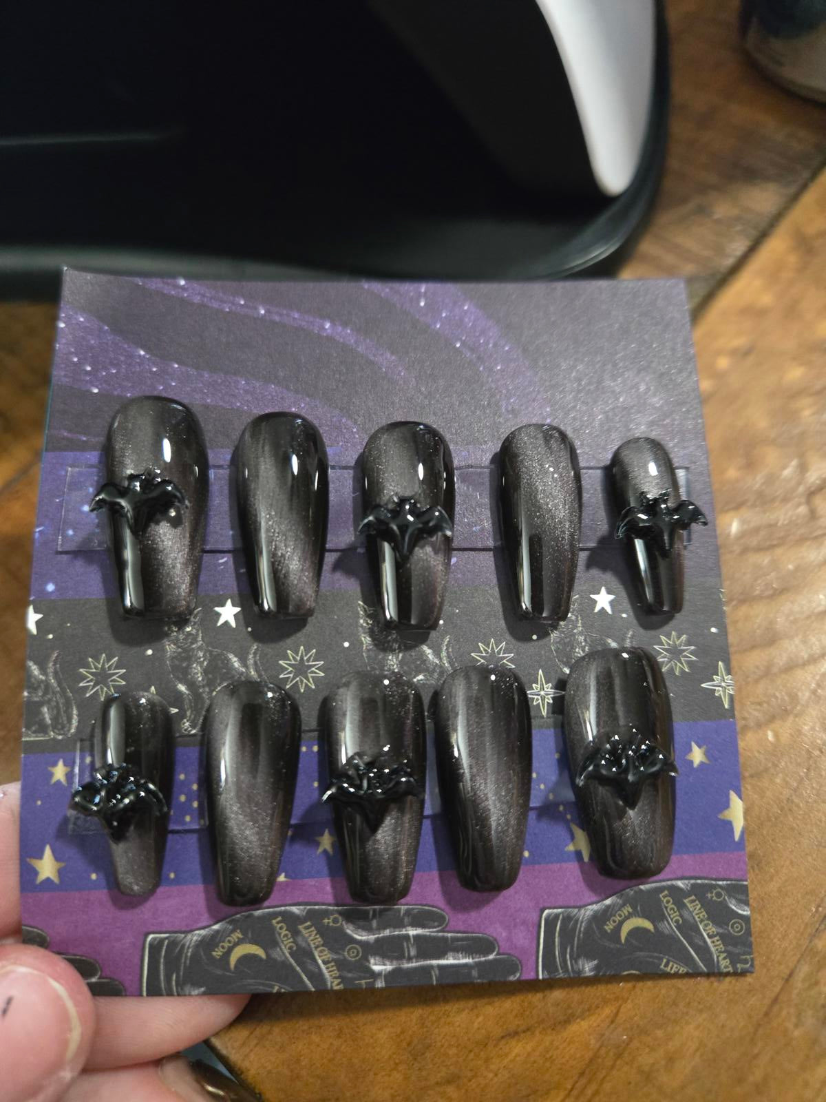 Black and silver cat eye nails with bats custom made