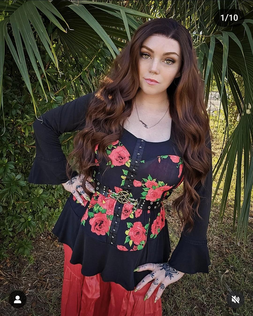 Rose corset style tunic top with bell sleeves and ruffle hem