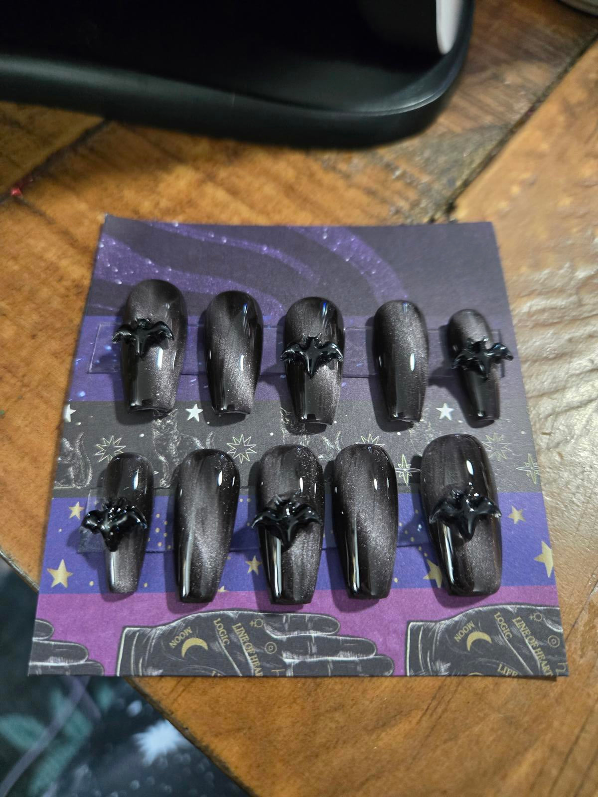 Black and silver cat eye nails with bats custom made