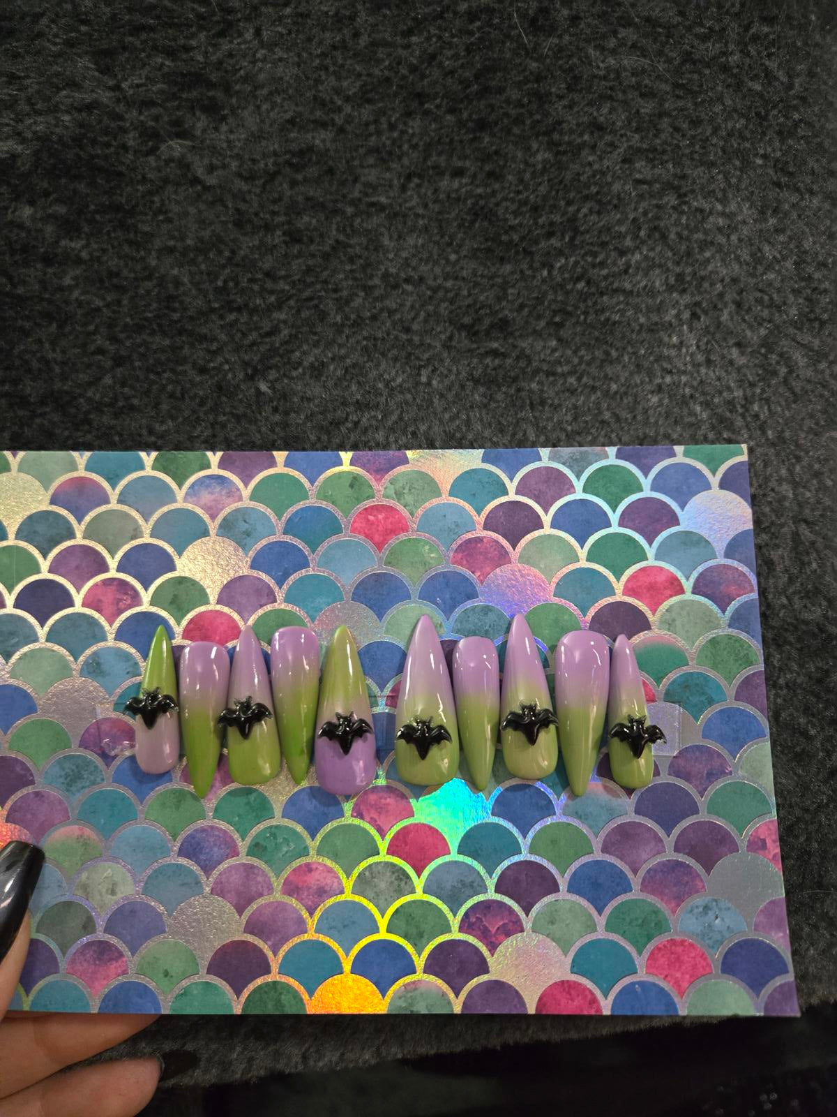 Long stiletto press on nails green to lavender ombre with bat charms