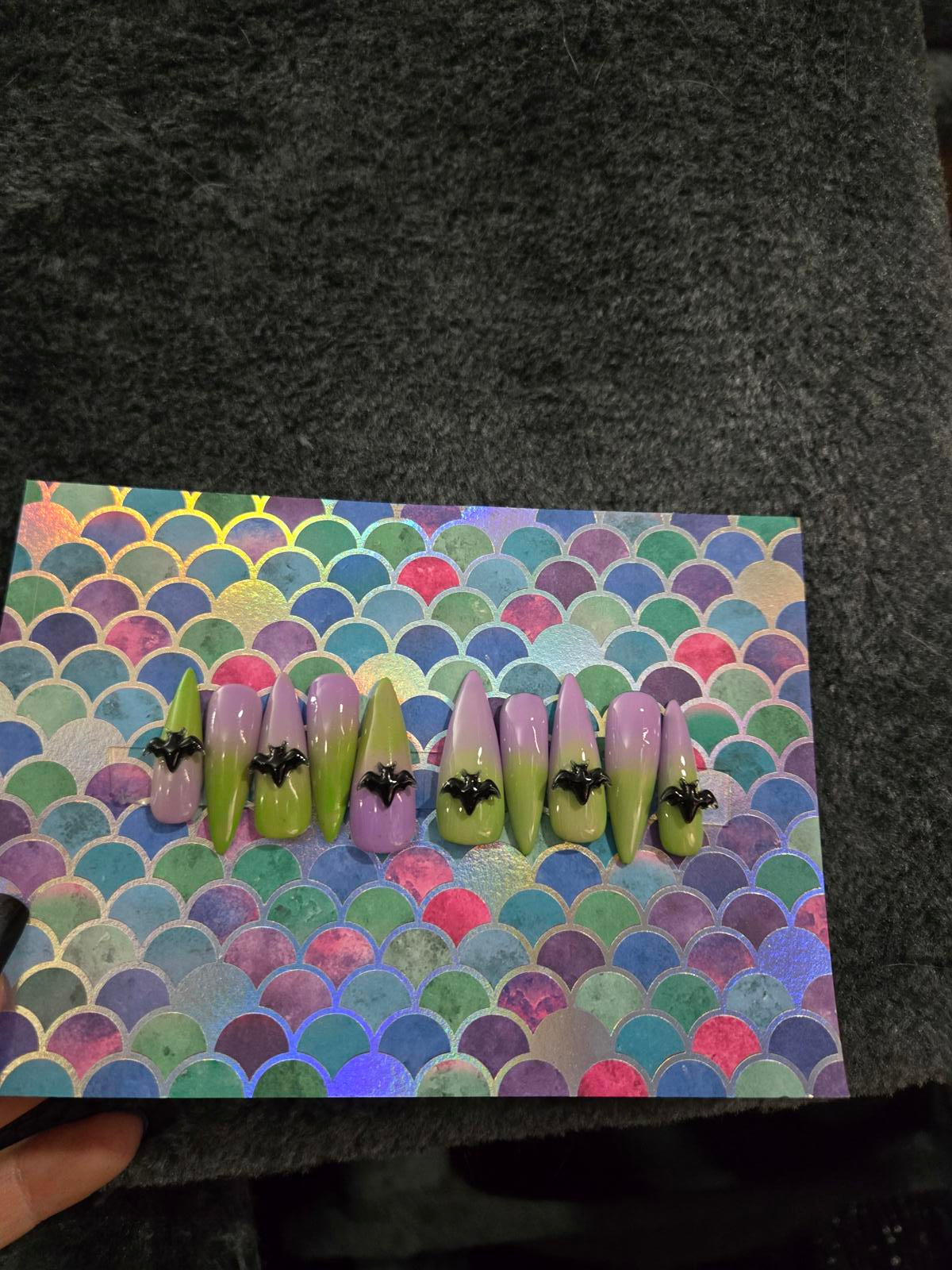 Long stiletto press on nails green to lavender ombre with bat charms