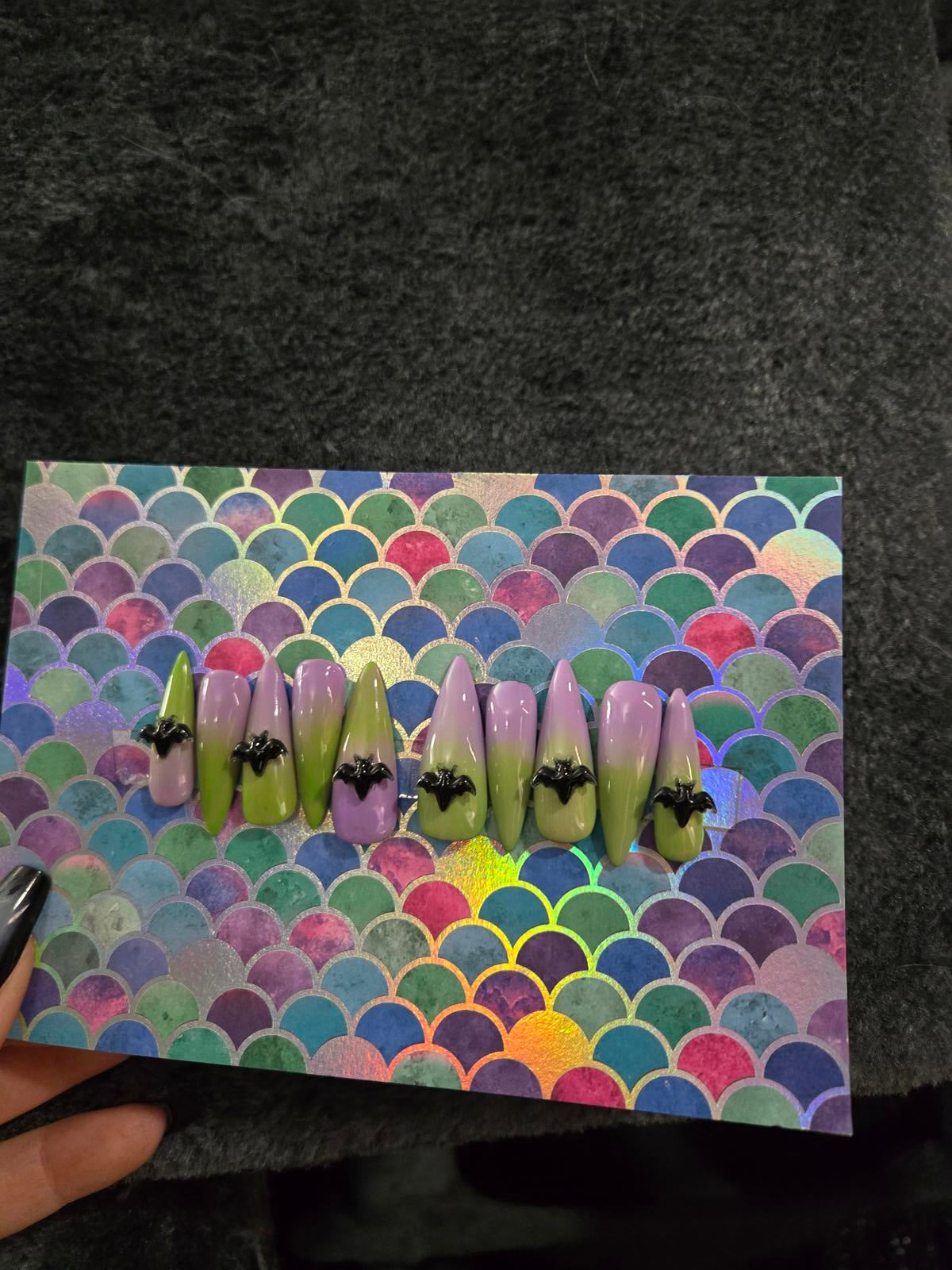 Long stiletto press on nails green to lavender ombre with bat charms