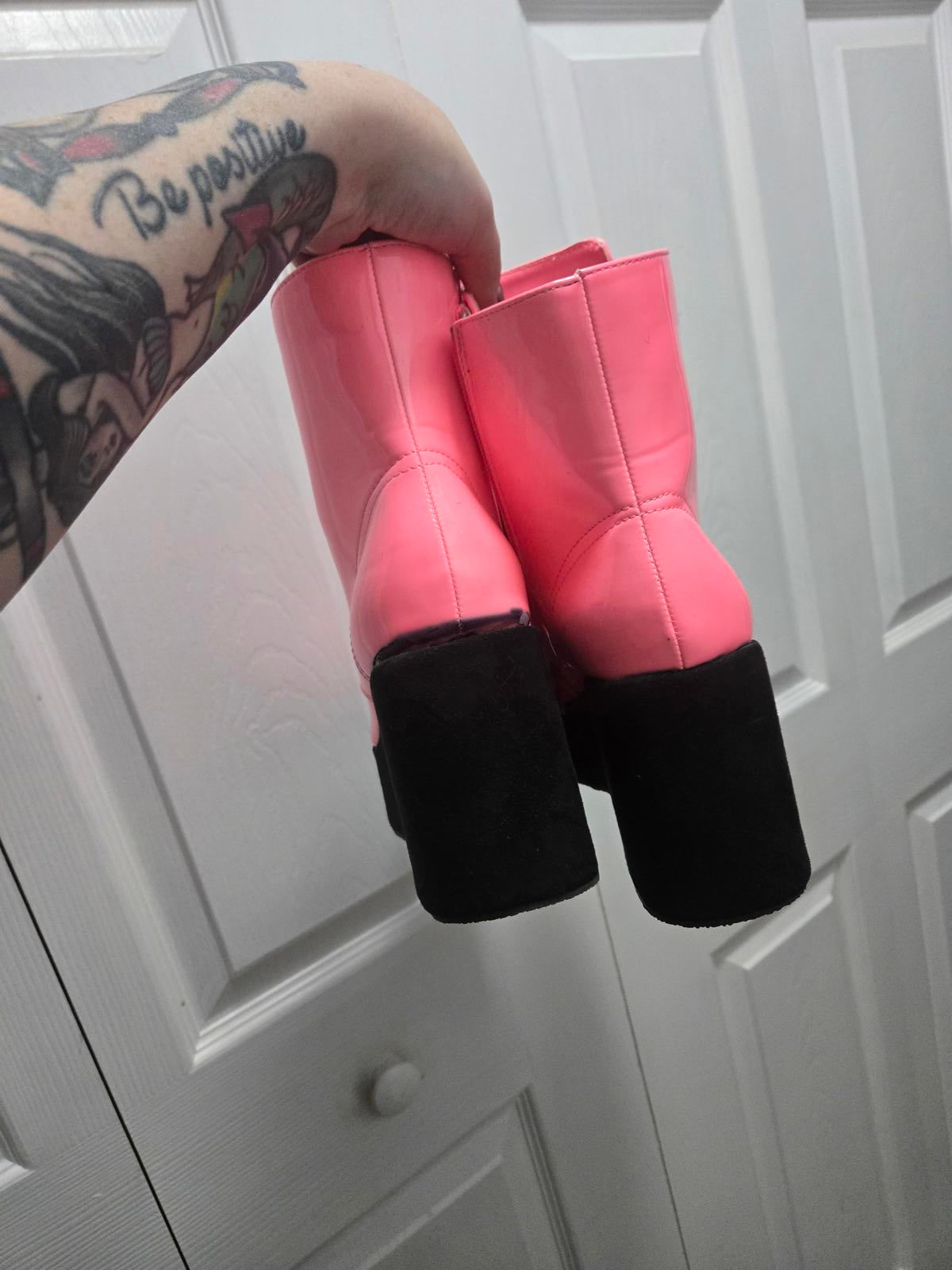 Neon pink lace up platform boots