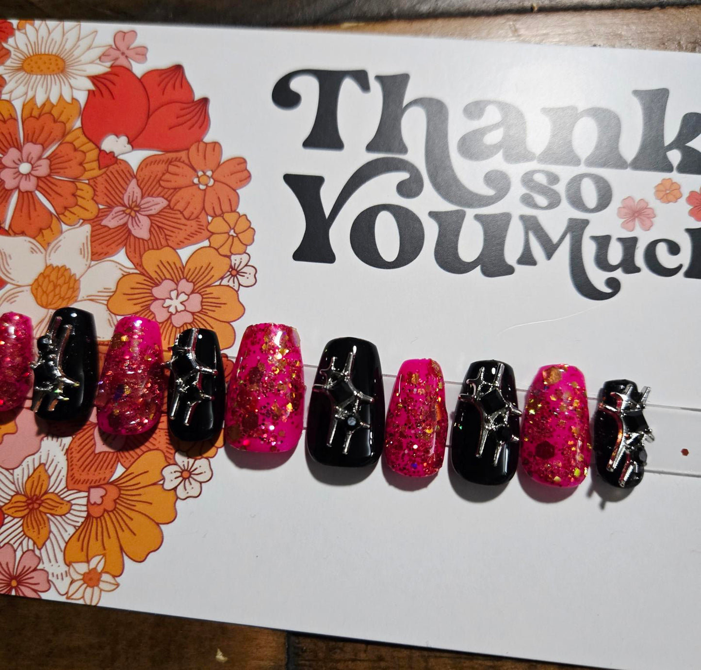 Short coffin chunky pink glitter and black press on nails with charms
