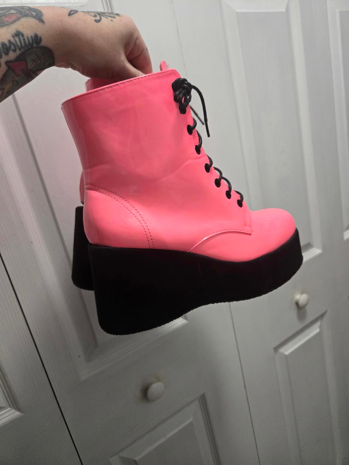 Neon pink lace up platform boots