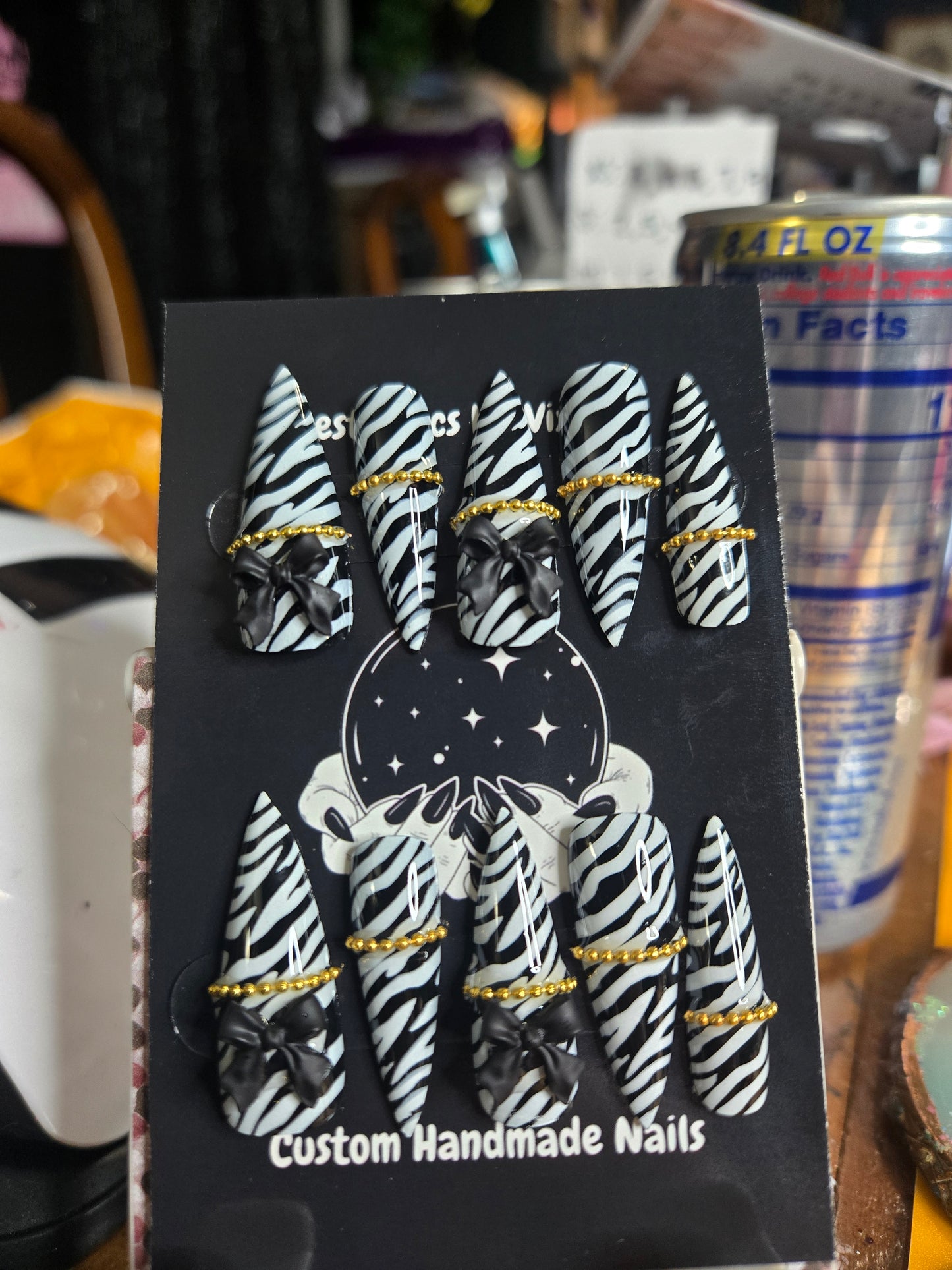 Zebra bow and chain stiletto nails