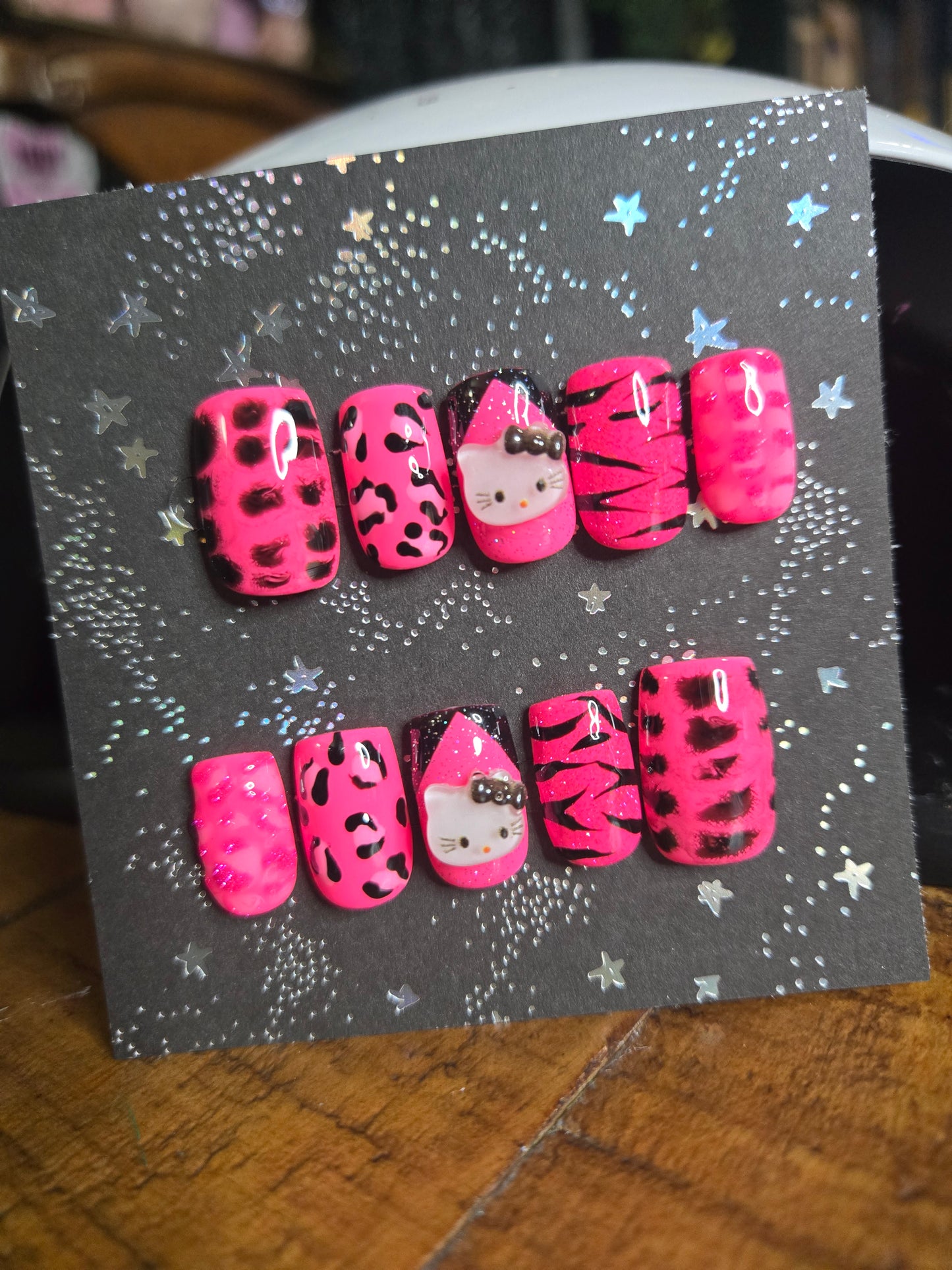Hello Kitty hot pink animal print nails