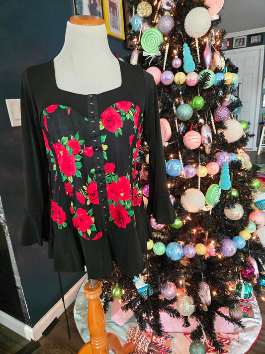 Rose corset style tunic top with bell sleeves and ruffle hem