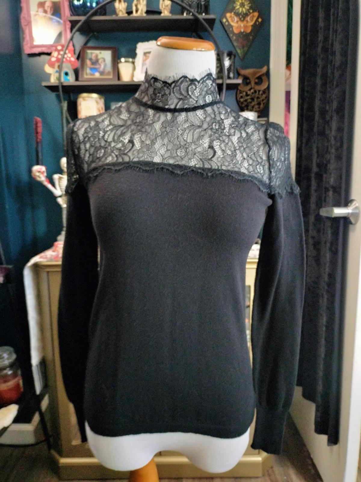 Jenifer Lopez black long sleeve lace blouse