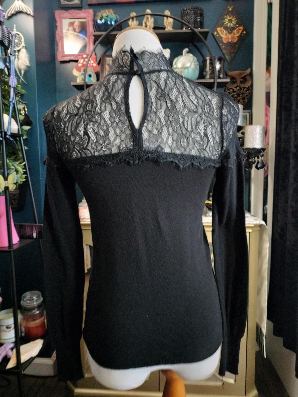 Jenifer Lopez black long sleeve lace blouse