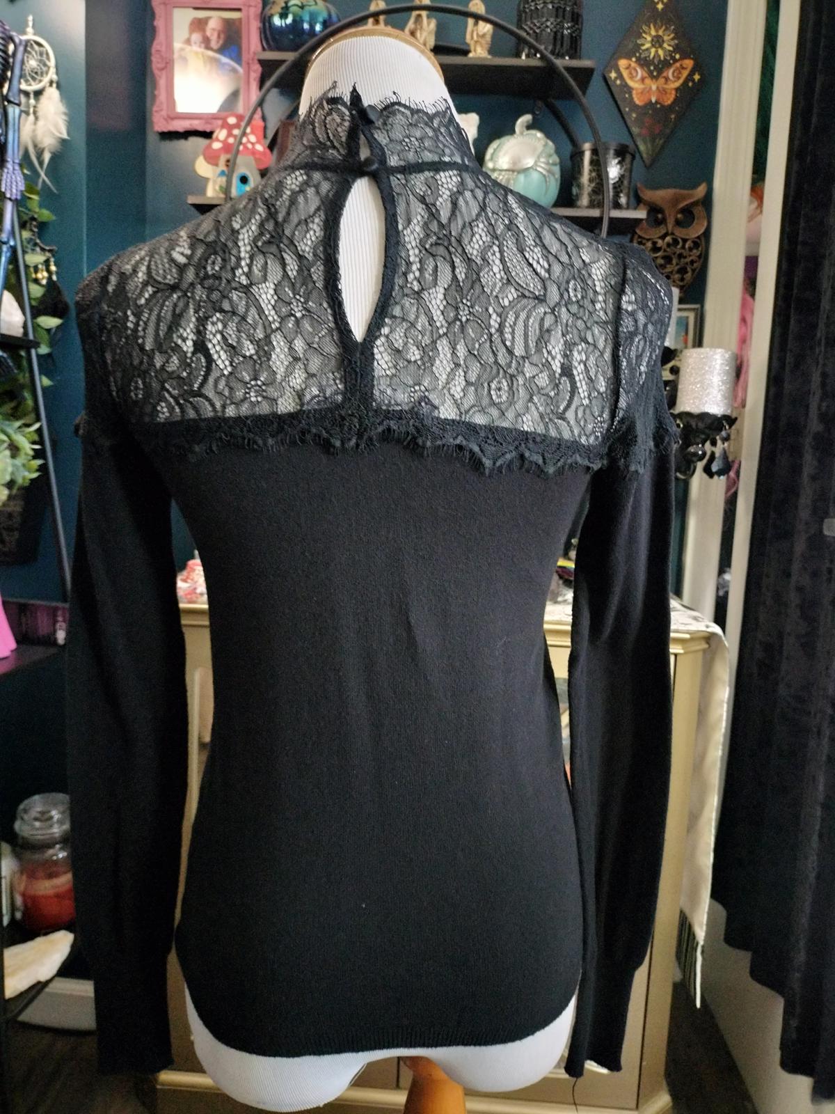 Jenifer Lopez black long sleeve lace blouse