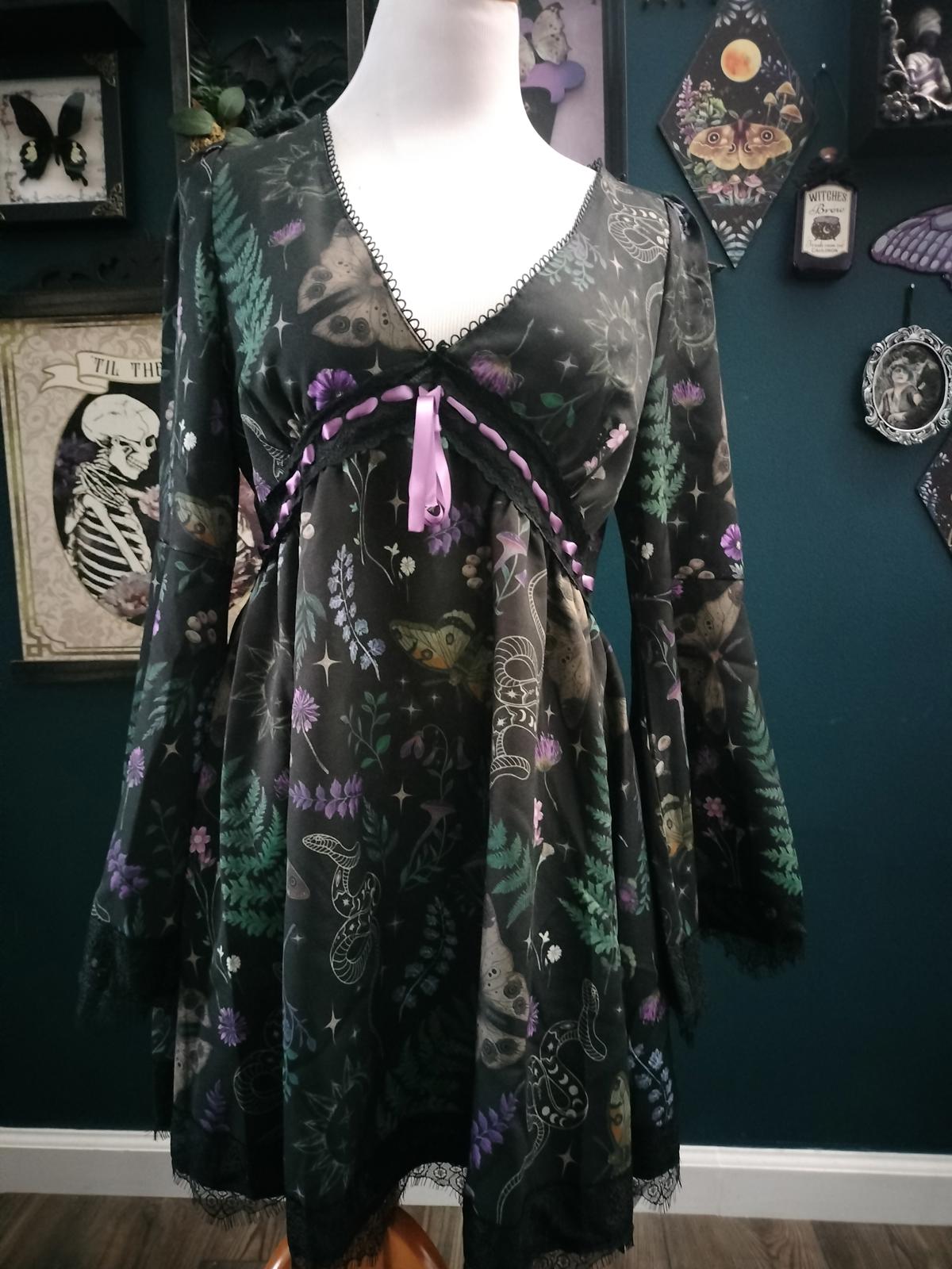 Witchy black dress with moths, mushrooms, flowers.