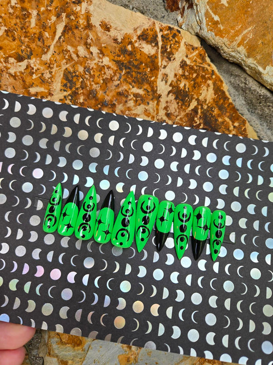 Green and black witchy stiletto nails custom made