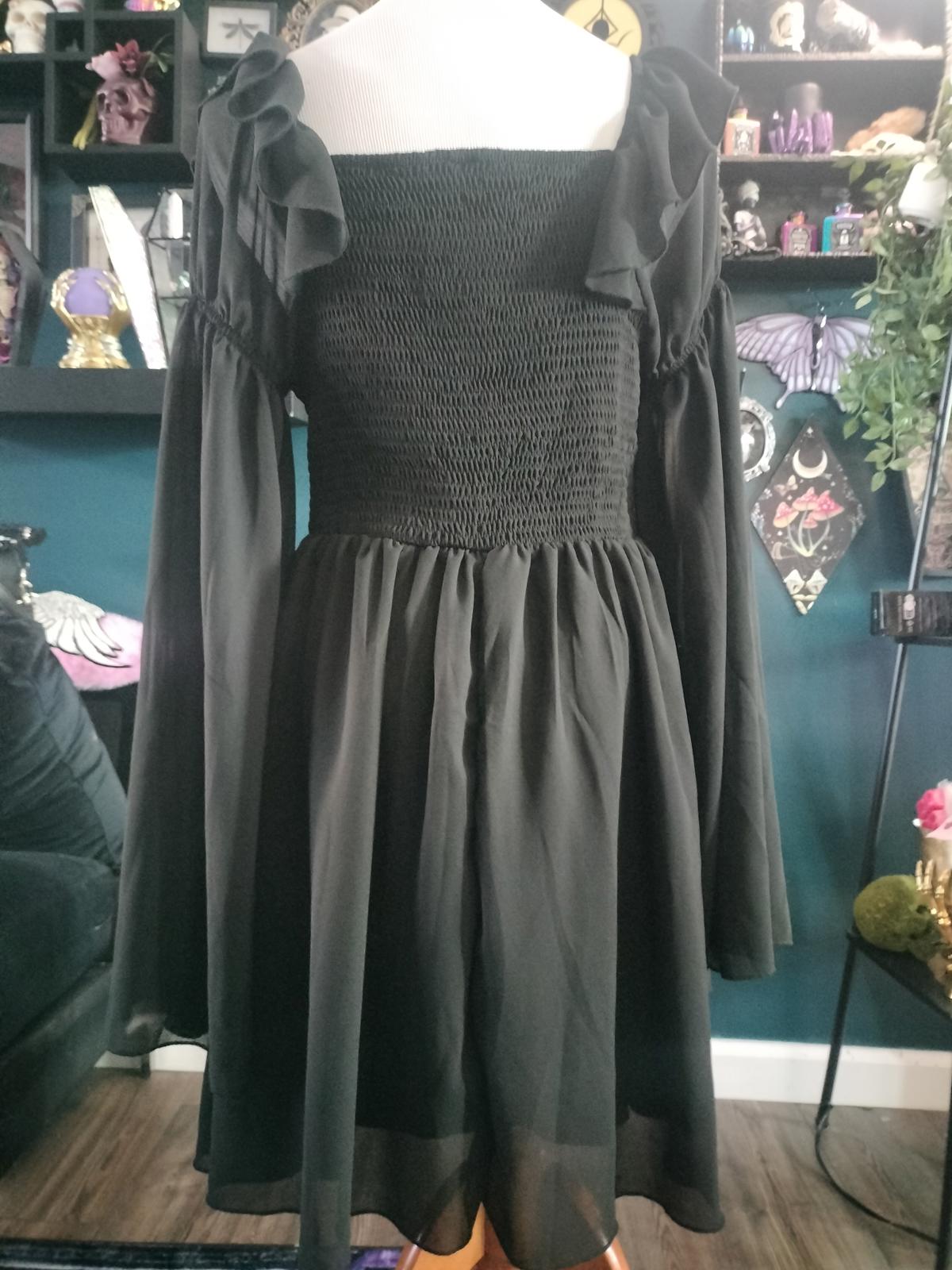 Black gothic dress with long sheer sleeves and lace up front