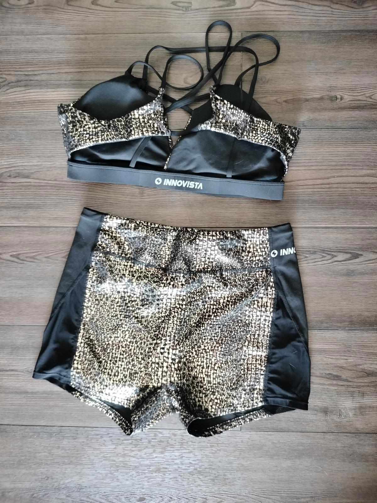 Black and gold activewear shorts and sports bra set