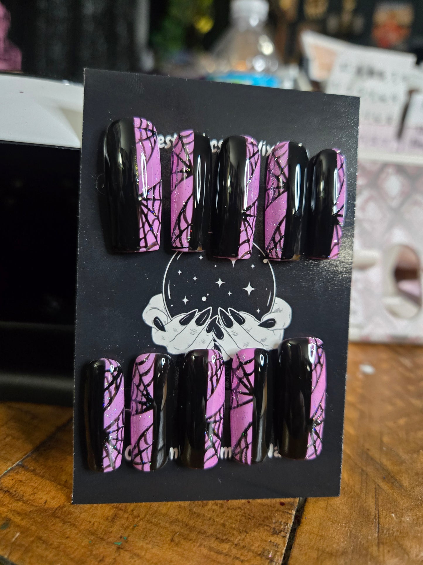 Split pink and black spiderweb nails