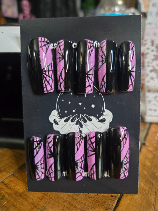 Split pink and black spiderweb nails