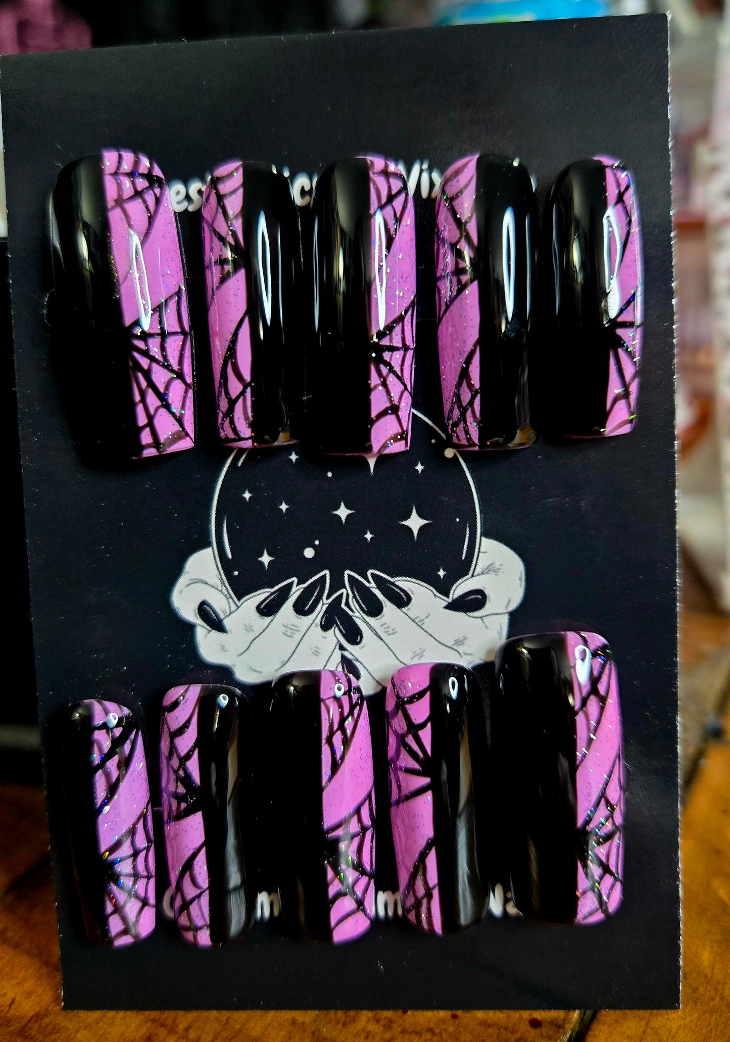 Split pink and black spiderweb nails